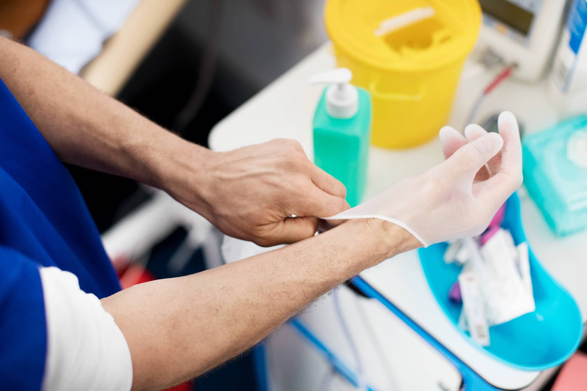 Title Doctor_puts_on_sterile_gloves